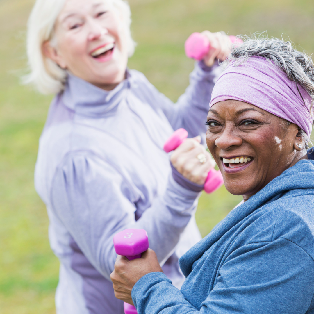 two older women exercising outside