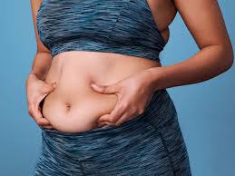 woman pinching belly fat