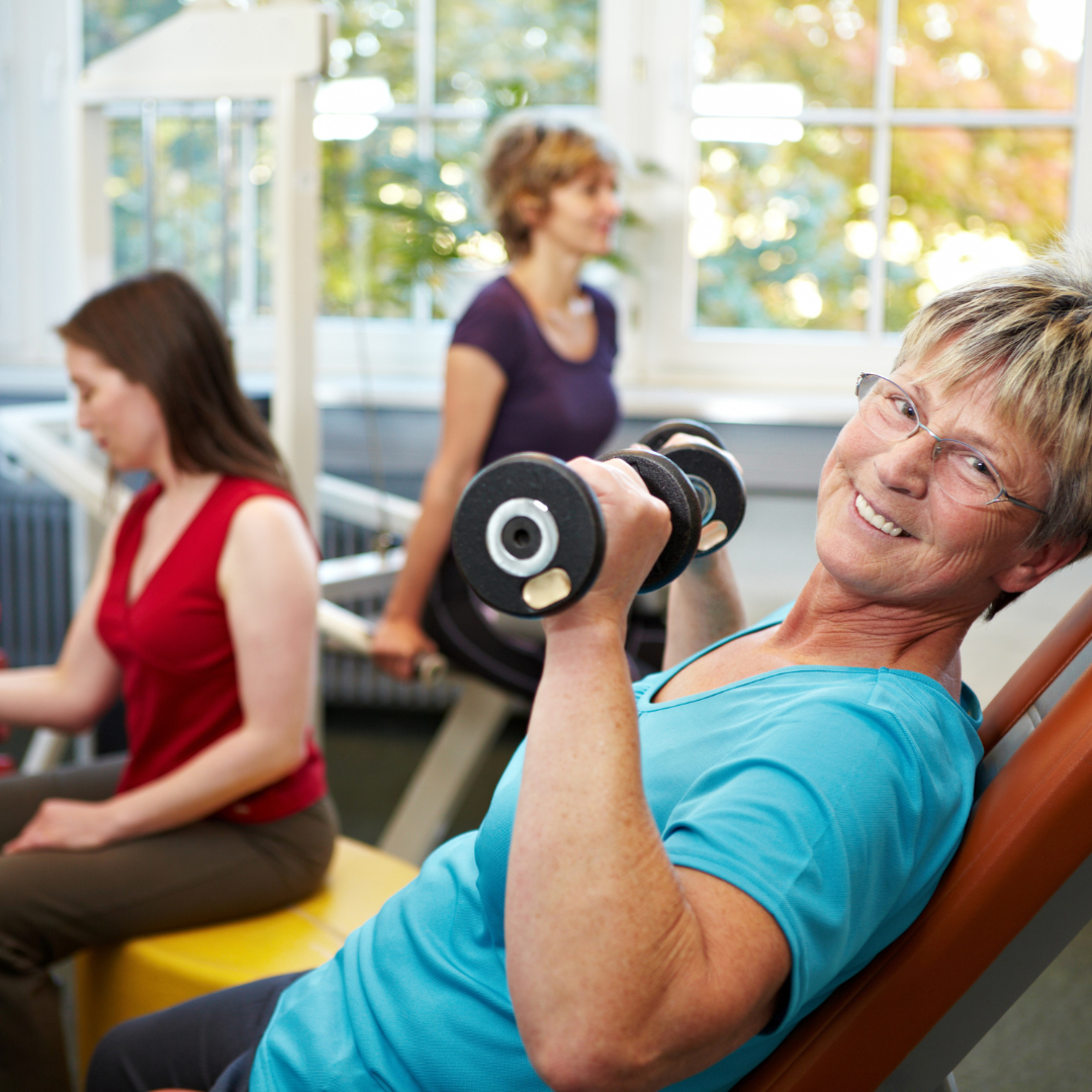 happy woman with dumbbells