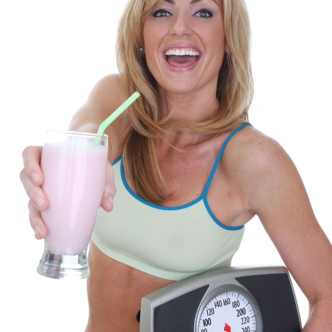 woman with scale and protein shake 