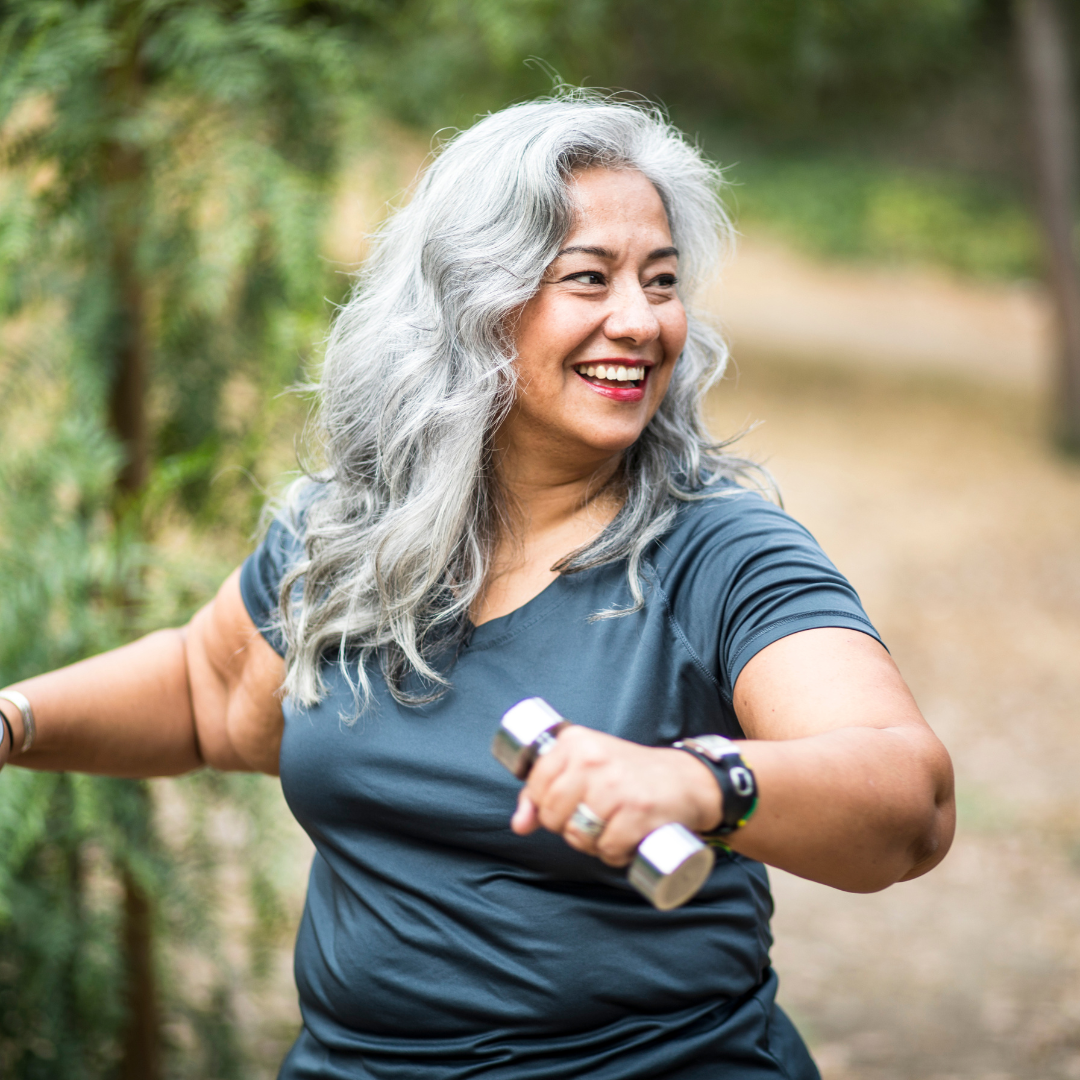 woman over 50 with dumbbells