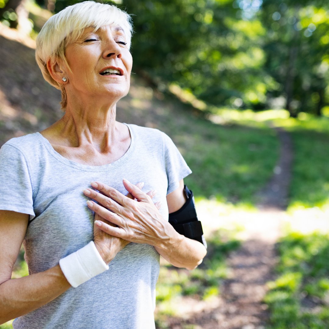 woman grabbing heart