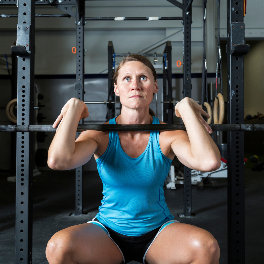 woman in a squat rack